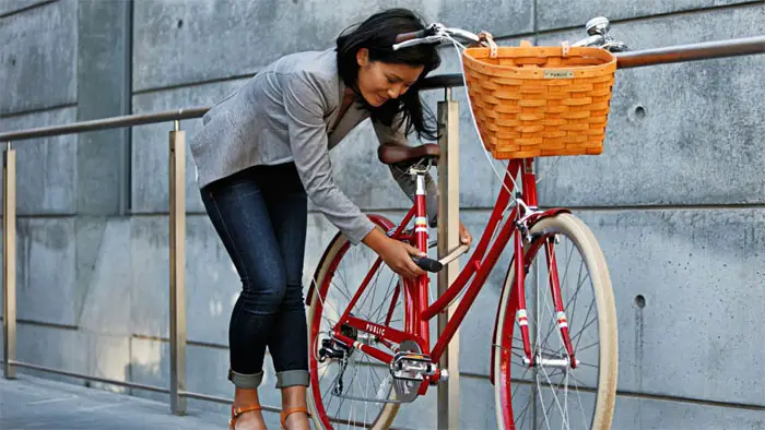 Woman Locking with Bike Lock
